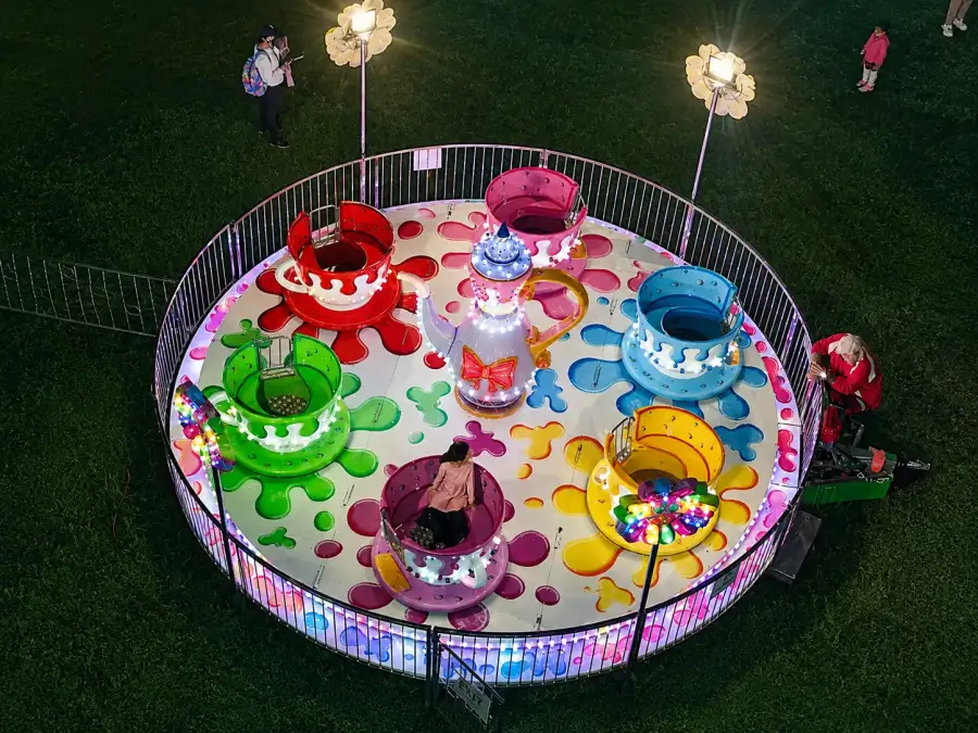 Children enjoying a colourful inflatable attraction